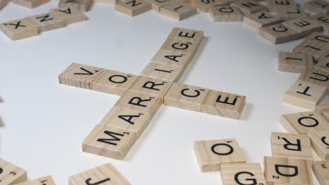 Crossword-is-made-on-white-table-with-words-MARRIAGE-and-DIVORCE