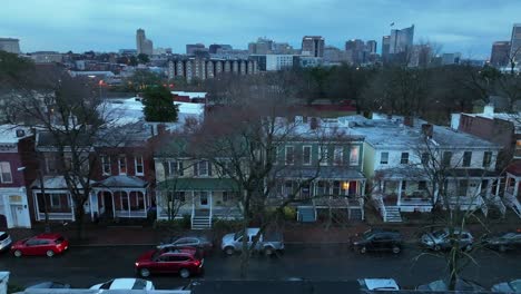 Colorful-american-houses-with-driving-car-on-street-at-dusk