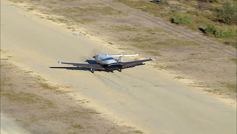 Tourist-aircraft-taxing-on-a-dirt-strip-in-the-Okavango-Delta-in-Botswana