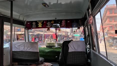 Interior-of-a-driving-bus,-streets-of-Kathmandu,-Nepal