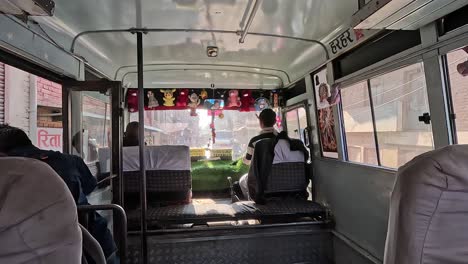 Interior-of-a-driving-bus,-chaotic-streets-of-Kathmandu