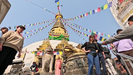 Walk-up-the-stairs-approaching-Swayambhu-stupa-and-Pratappur-shikara-at-Swayambhunath-Buddhist-temple,-Kathmandu,-Kathmandu-Valley,-Nepal