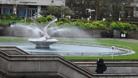 Walking-down-the-stairs-by-The-Mary-Seacole-Memorial-Statue,-London,-United-Kingdom