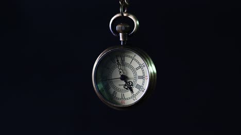 old-pocket-watch-on-black-background