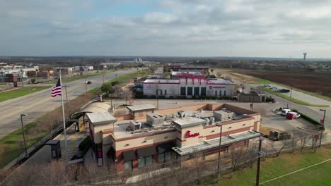 This-is-an-aerial-video-of-the-Chik-Fil-A-restaurant-in-Roanoke-Texas-located-at-1300-N-US-Hwy-377,-Roanoke,-TX-76262