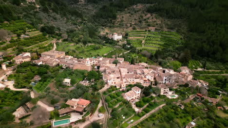 Aerial-view-of-Biniaraix-village-nestled-in-lush-Mallorcan-valley