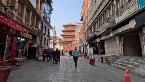 Wallk-along-Kathmandus-famous-old-Freak-Street-with-people-and-shop