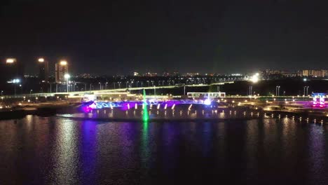 Establishing-Shots-both-happening-simultaneously-and-showing-colorful-lights-and-lots-of-people-watching