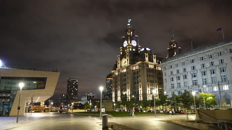 Liverpool,-England-UK-at-Night,-Royal-Liver-Palace,-Mersey-Ferry-Building-and-People-on-River-Promenade