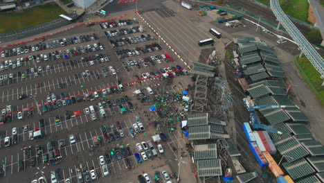 Aerial-View-Of-Local-Fans-Partying-At-Parking-Lot-Of-Oakland-Athletics-In-California-In-Protest-To-Selling-Of-Baseball-Team-To-Las-Vegas