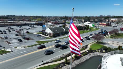 Aerial-close-up-of-an-American-flag-waving-on-a-windy-day