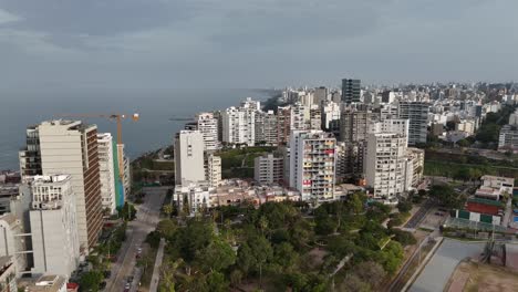 Aerial-drone-morning-footage-of-Lima-skyline,-the-capital-city-of-Peru-in-South-America-Miraflores-Chorrillos-Barranco-Malecón-de-Miraflores-cliffs