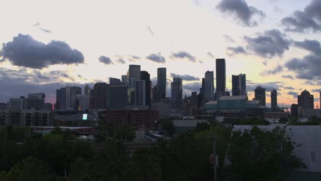 Drone-shot-that-reveals-downtown-Houston,-Texas-at-night