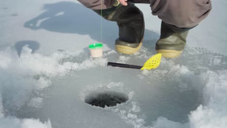 Cropped-View-Of-A-Man-On-Winter-Ice-Fishing