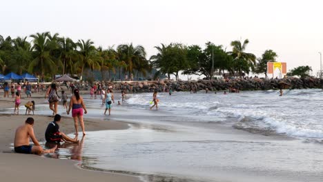 Tourists-and-Locals-running-down-the-beach-during-the-evening
