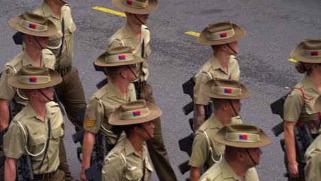 Close-up-shot-of-armed-Australian-army-troop-from-Australian-Defence-Force,-uniformly-marching-down-the-street,-participating-the-parade-tradition,-amidst-the-solemnity-of-the-Anzac-Day-commemoration