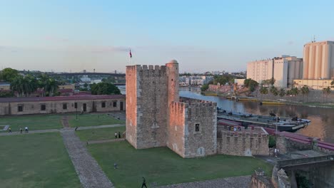 Iconic-UNESCO-site-Ozama-Fortress-on-river-bank-in-Santo-Domingo,-aerial-view