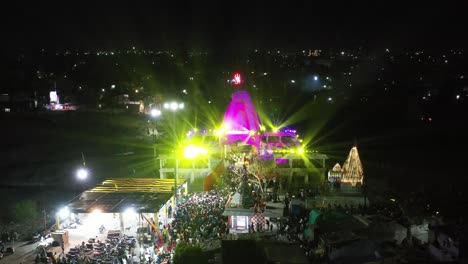 Aerial-drone-view-drone-Camera-parking-the-bike-and-going-to-visit-the-temple-where-there-is-a-lot-of-traffic-jam