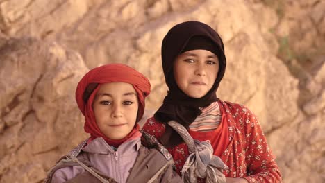 portrait-shot-of-amazigh-little-Moroccan-twins-brother-and-sister-with-happy-faces-in-The-gorges-of-Toudgha