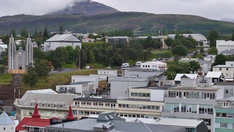 Akureyri,-Iceland,-Drone-Shot-of-Downtown-Buildings-and-Church-on-Cloudy-Day