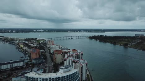 Clearwater,-Florida,-Hotels,-and-Causeway-Bridge,-Rain-Clouds,-aerial