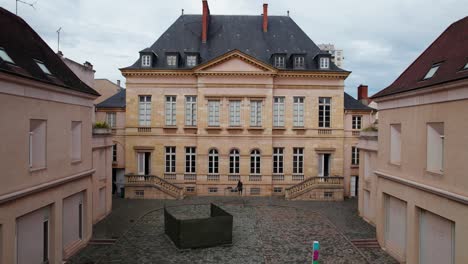 aerial-shot-revealing-and-tilting-down-museum-of-fine-arts-and-achaeology-in-Roanne,-Forez,-Loire-department,-auvergne-rhone-alpes-region