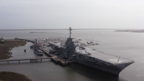 Panning-close-up-aerial-shot-of-the-historic-USS-Yorktown-CV-10-aircraft-carrier-at-Patriot's-Point-in-Mount-Pleasant,-South-Carolina