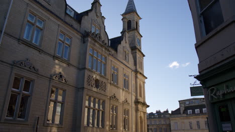 The-Clock-Tower-Situated-at-Sawclose,-Bath,-Somerset,-England---Low-Angle-Shot