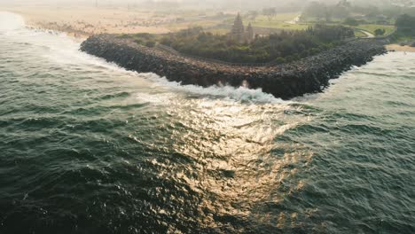 Aerial-Over-Bay-Of-Bengal-Ocean-With-Reveal-Of-Shore-Temple-In-Chennai