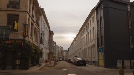 Tracking-shot-of-empty-suburban-street-in-Antwerp-city-with-sunset