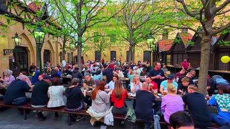 Crowd-Of-People-Dining-Al-Fresco-In-Daytime-At-Historic-Brewery-Restaurant-In-Prague,-Czech-Republic