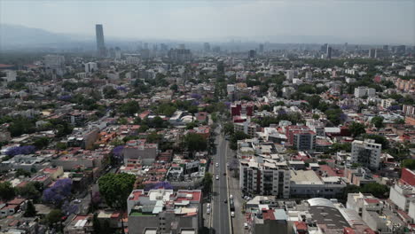 Moving-forward-over-the-mexico-city-south,-viewed-from-a-drone