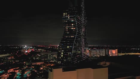 An-aerial-view-of-the-Seminole-Hard-Rock-Hotel-and-Casino-illuminated-with-lights-at-night