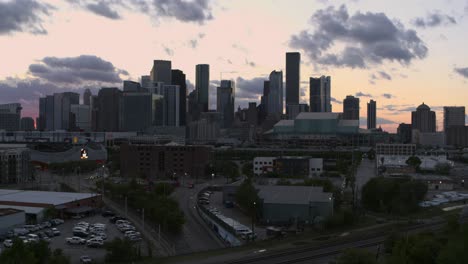 Drone-shot-of-downtown-Houston,-Texas-moving-backwards