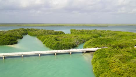 Drone-shot-from-the-Boca-Paila-Bridge,-view-of-the-union-of-the-sea-and-the-lake