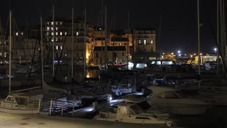 View-at-night-of-Bastia-Harbor-on-island-of-Corsica,-slow-pan-left-to-right