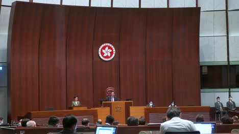 Wide-shot-view-of-Carrie-Lam-,-former-Hong-Kong's-chief-executive,-delivers-the-annual-policy-address-at-the-Legislative-Council-building-main-chamber-in-Hong-Kong