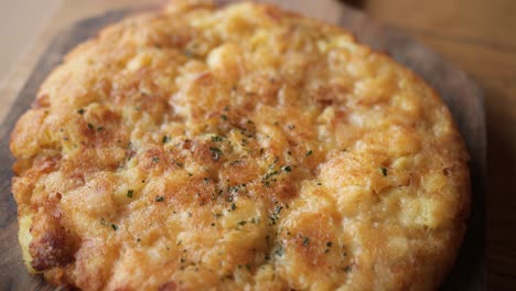 omlette-top-down-pan,-greasy-dish-typical-for-slovenia,-made-of-cheese-and-potato