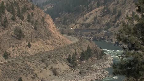 Cars-and-trucks-on-the-Trans-Canada-Highway-in-the-Thompson-River-Canyon,-British-Columbia-Canada