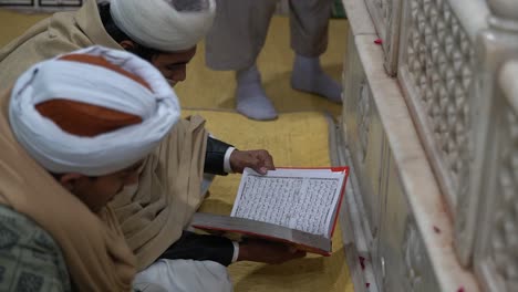 Close-up-shot-of-a-young-boys-reciting-the-Holy-Quran