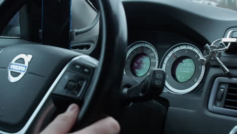 View-of-Volvo-dashboard-speedometer,-instruments-while-driving-on-road