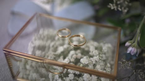Wedding-bands-on-floral-glass-box
