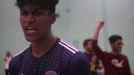 Futsal-Player-Celebrating-Exuberantly-In-Indoor-Gym-Arena