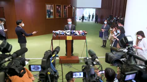 Hong-Kong-Financial-Secretary,-Paul-Chan-Mo-po,-is-seen-during-a-news-conference-moments-after-Chief-Executive-Carrie-Lam-delivered-the-annual-policy-address-at-the-Legislative-Council-building