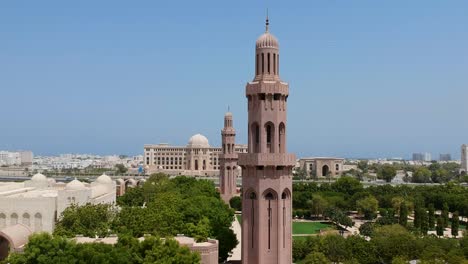 Aerial-view-revealing-stunning-Sultan-Qaboos-Grand-Mosque-and-minaret-in-Muscat,-Oman