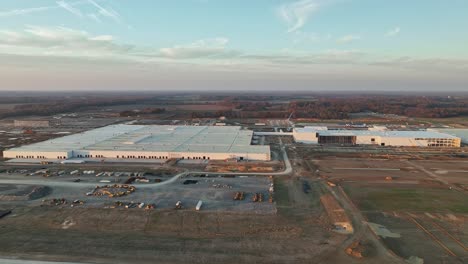 Drone-orbiting-Ford's-Megacampus,-BlueOval-City-at-Sunset-in-Stanton,-TN