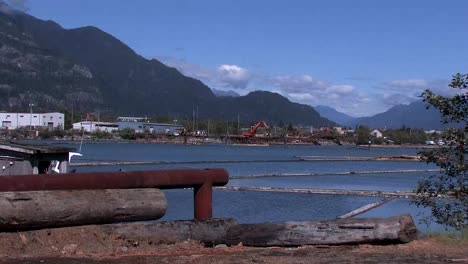 Log-loader-across-river-with-mountain-view