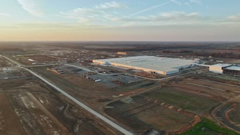 Aerial-orbit-of-Ford's-Megacampus,-BlueOval-City-at-dusk-in-Stanton,-TN