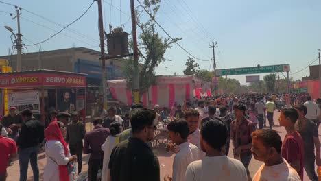 Many-people-are-selling-different-kinds-of-things-in-the-market-and-different-kinds-of-food-stalls-are-seen-built-and-many-people-are-walking-towards-the-Tirtha-temple-for-darshan