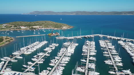 A-drone-captures-Athens'-private-yacht-harbor,-showcasing-a-sea-filled-with-numerous-small-sailboats